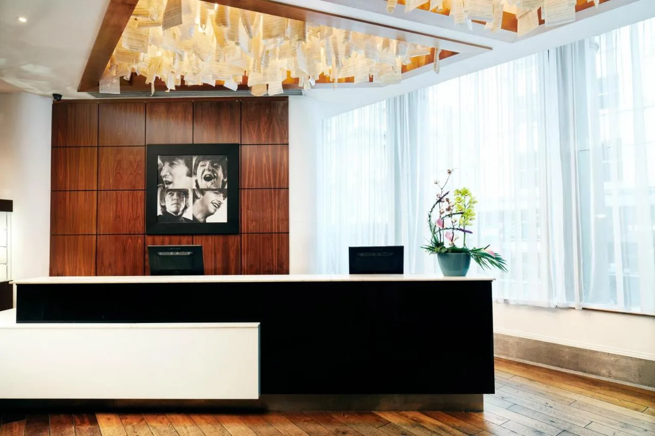 a lobby with a reception desk in a building at Hard Days Night Hotel Liverpool in Liverpool