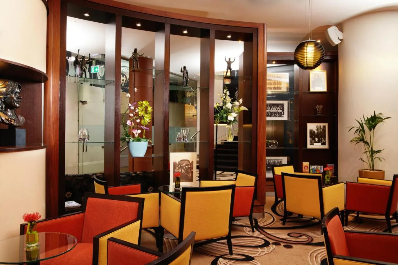 a restaurant with a bunch of chairs and tables at Hard Days Night Hotel Liverpool in Liverpool